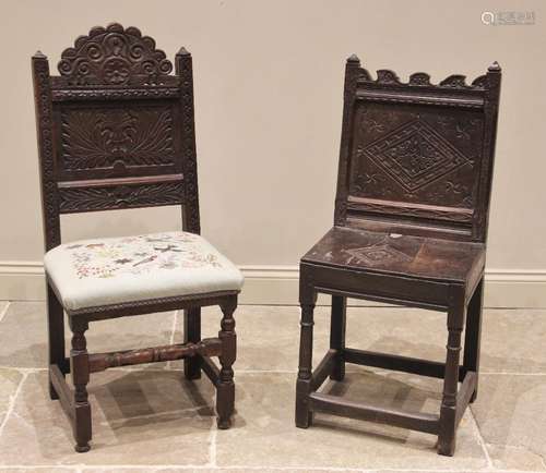 A 17th century carved oak back stool, the carved scroll top ...