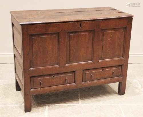 An 18th century oak mule chest, the moulded three plank top ...