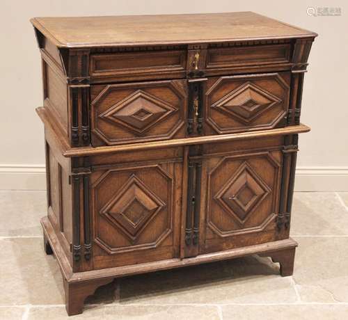 A Jacobean oak two section chest, late 17th century, the mou...