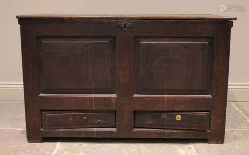 An 18th century oak mule chest, the rectangular hinged top o...