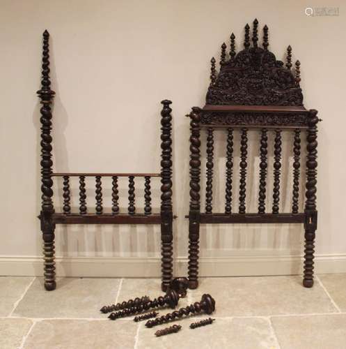 A 17th century style German carved walnut bed frame, the spi...