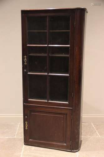 A 19th century mahogany freestanding bookcase, rounded to th...