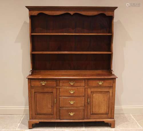 A George III style golden oak dresser, in the manner of Titc...