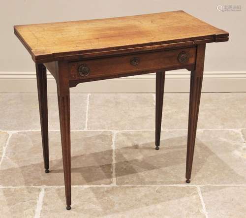 A George III mahogany folding card table, the rectangular hi...