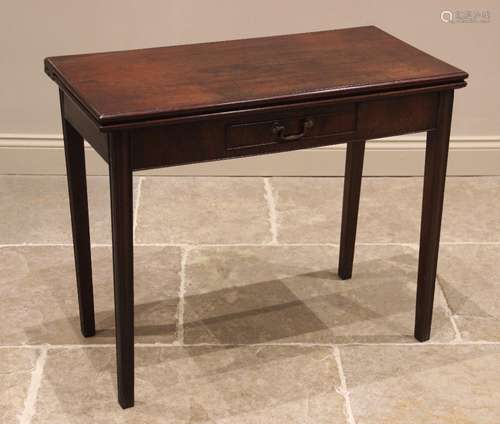 A George III mahogany tea table, the rectangular hinged top ...