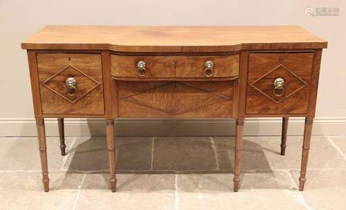 A late George III mahogany breakfront sideboard, the shaped ...