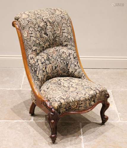 A Victorian mahogany low seat nursing chair, in tapestry sty...