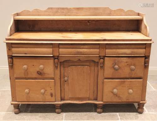 A Victorian pine dresser base, the shaped three quarter gall...