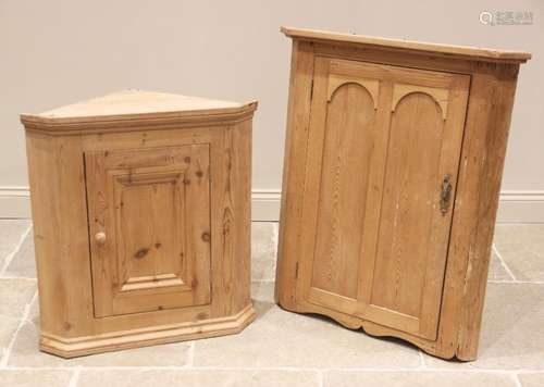 A Victorian style pine hanging corner cupboard, the moulded ...