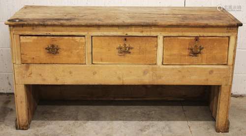 A Victorian pine work bench/dresser, the plank top above thr...