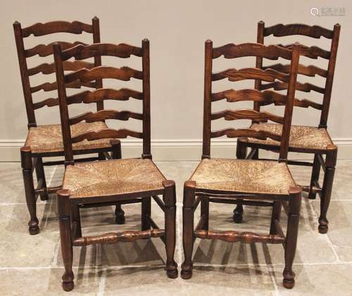 A set of four ash ladder back kitchen chairs, 19th century, ...