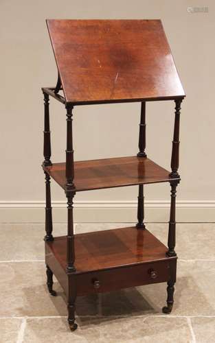 A mahogany three tier whatnot with adjustable reading slope,...