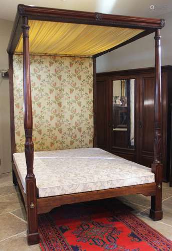 A 19th century mahogany tester bed, the moulded frame and fo...