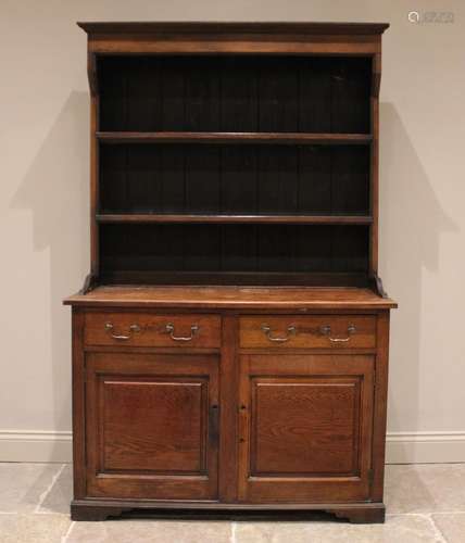 A George III oak country dresser, the rectangular base with ...