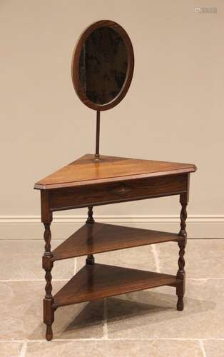 An oak corner shaving stand, circa 1920, the adjustable oval...