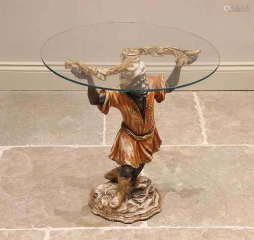 A Blackamoor glass top drinks table, 20th century, the circu...