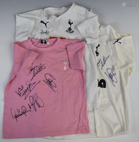 Three Tottenham Hotspur football shirts, each signed by mult...