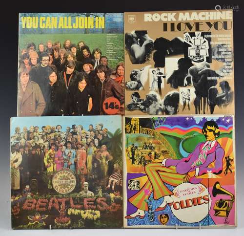 A collection of 12 albums including The Beatles, The Moody B...