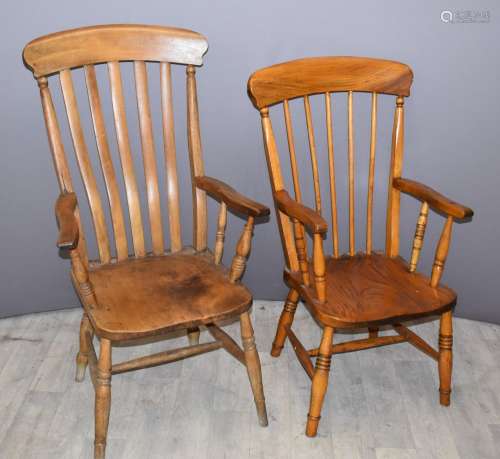 Two Windsorhigh backed elm seated armchairs