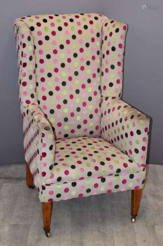 Polka dot upholstered wing back armchair