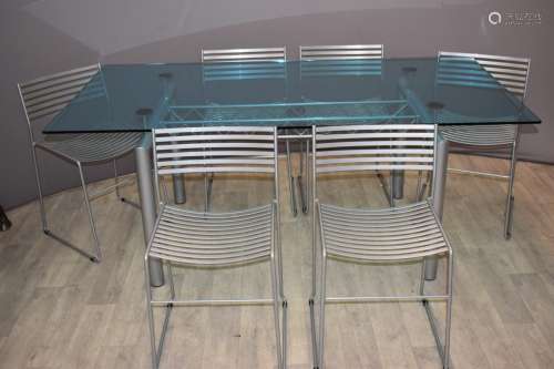 Designer glass dining table and six chairs with industrial g...