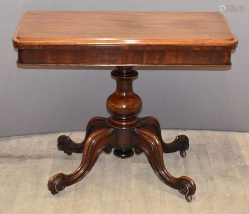 Victorian mahogany fold over card table raised on bulbous ba...