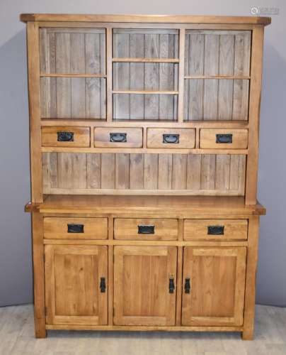 Contemporary solid oak dresser with seven drawers, cupboards...