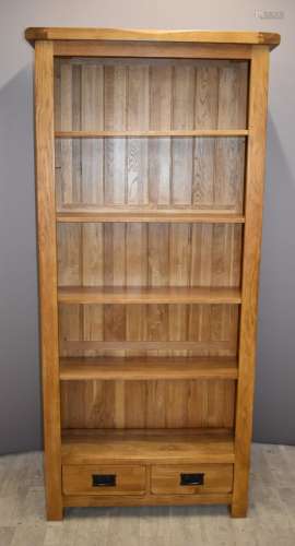 Contemporary solid oak bookcase with two drawers under and a...