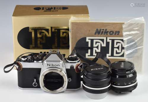 Nikon FE 35mm SLR camera with 28mm 1:2.8 and 50mm 1:2 lenses...