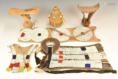 A collection of tribal beaded items and headrests from Turka...