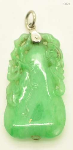 A carved jadeite pendant in the form of a pear and foliage, ...