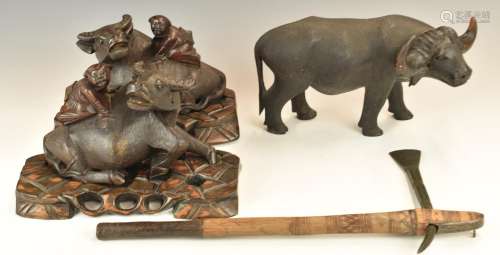 A pair of Chinese woodencarving of water buffalo with figure...