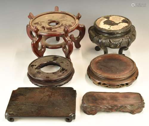 Six Chinese19th / 20thC carved hardwood stands, tallest 19cm...