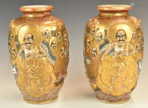 Pair of Japanese vases with figural decoration, height 23cm