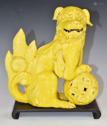 Chinese 19thCyellow glazed Dog of Fo figure, on wooden stand...