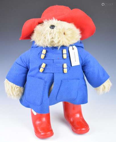 Paddington Bear teddy bear with label, blue jacket and red h...