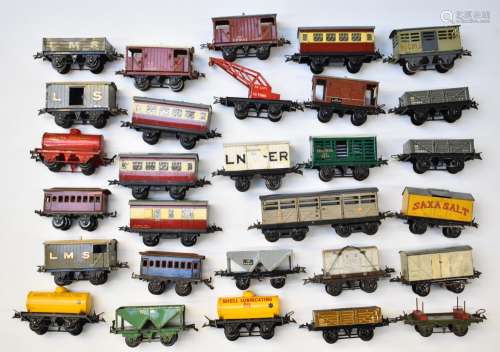 Twenty nine Hornby 0 gauge model railway wagons, vans, coach...