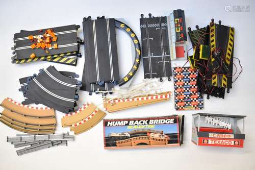 A collection of Scalextric model slot racing track and acces...