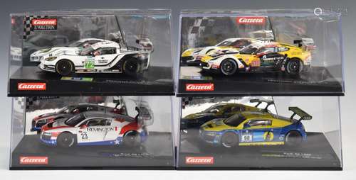 Four Carrera Evolution model slot racing cars including Audi...