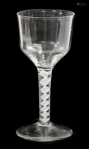 A Glass Goblet, circa 1750, the ogee bowl on an opaque twist...