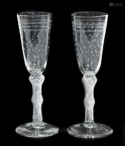 A Pair of Ale Flutes, circa 1750, the rounded funnel bowls e...
