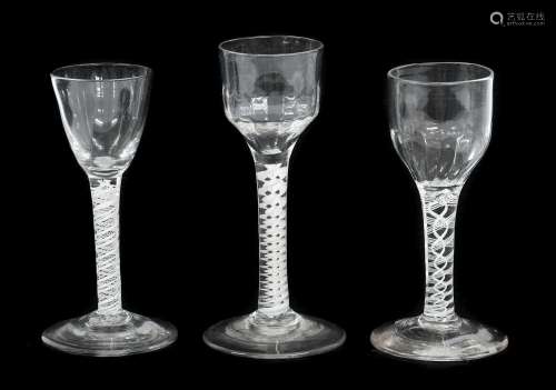 A Wine Glass, circa 1750, the semi-fluted ogee bowl on an op...