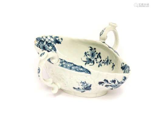 A Worcester Porcelain Two-Handled Sauceboat, circa 1755, pai...