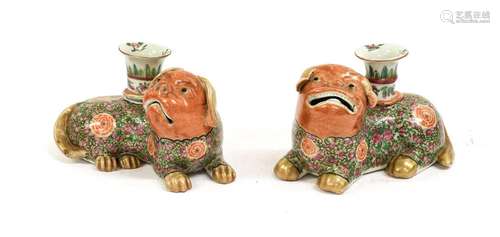 A Pair of Cantonese Porcelain Lion Dog Candlesticks, 19th ce...