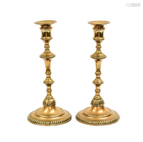 A Pair of Brass Candlesticks, mid 18th century, with circula...