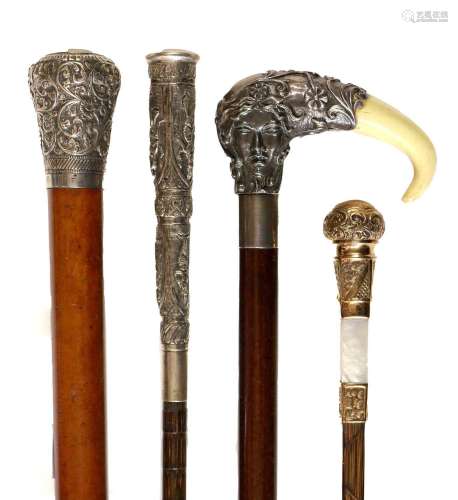 A White Metal and Ivorine Mounted Walking Cane, probably Ame...