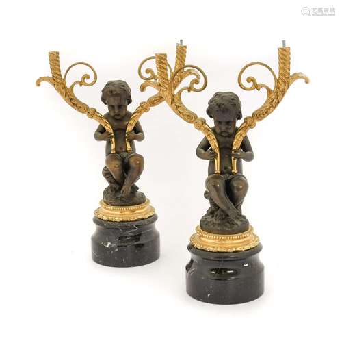 A Pair of French Gilt and Patinated Bronze Figural Candelabr...