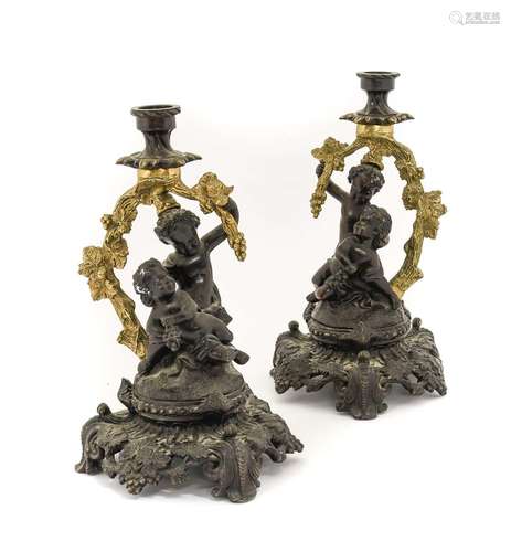 A Pair of French Gilt and Patinated Bronze Figural Candlesti...