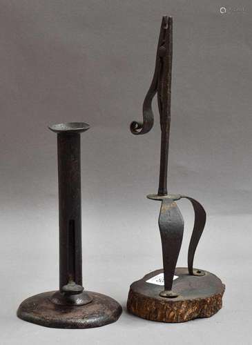 An Iron Rushlight, 18th century, of scissor form with scroll...