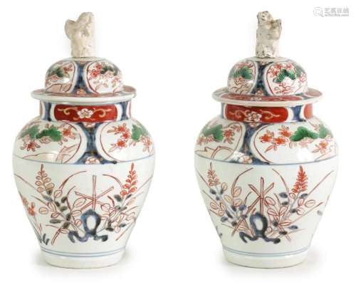 A PAIR OF EARLY 18TH CENTURY JAPANESE IMARI SHOULDERED VASES...